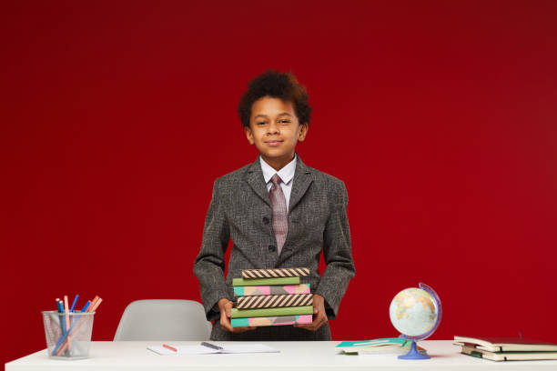African-American Schoolboy Posing with Books