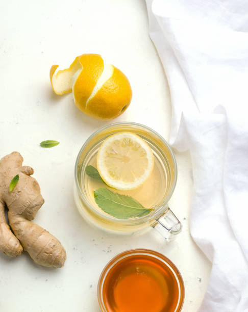 istock Healthy food immunity. Tea, lemon, ginger, mint, almonds. Vertical photo. 1225545842