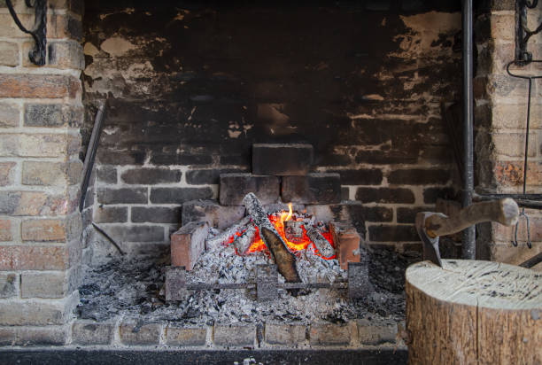 istock Fireplace with a burning fire, comfort and atmosphere. 1225545880
