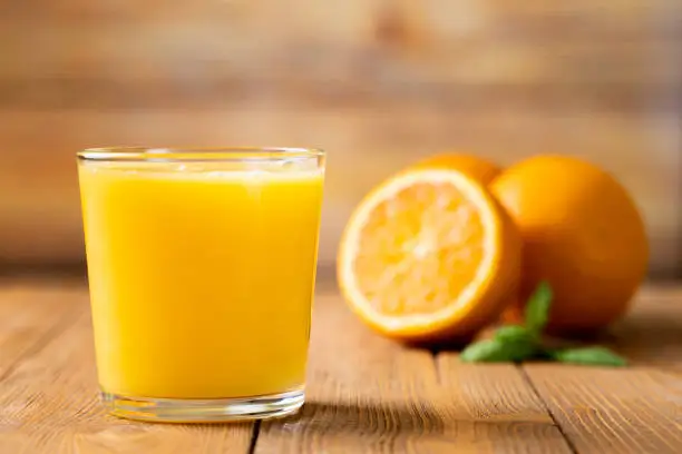 Shot of Fresh Orange Juice in a Glass