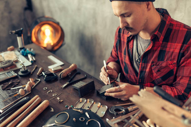 istock man designing his own jewelry line 1225546549
