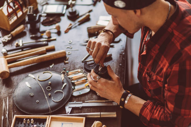 istock guy executing jewellery repair 1225546654
