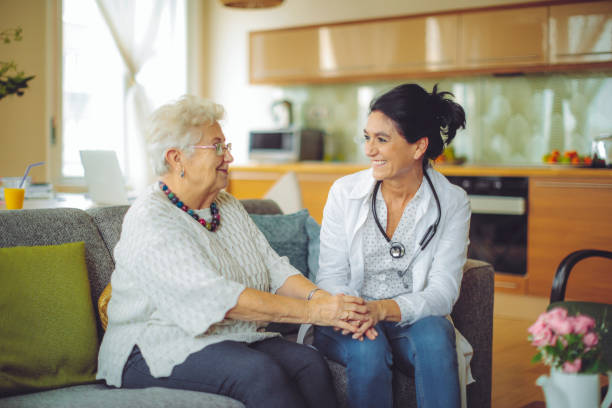 istock Social worker is visiting a senior woman 1225547514
