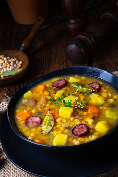 istock Rustic pea soup with bacon and sausages 1225547792