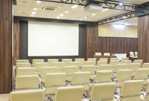 istock View from seats in auditorium at blank screen 1225549135