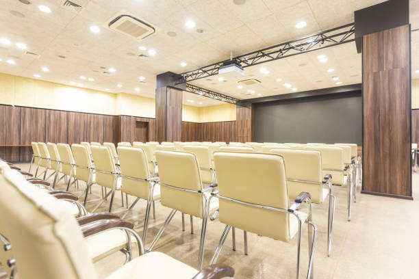 istock Audience for presentations. Large hall with wooden walls 1225549161