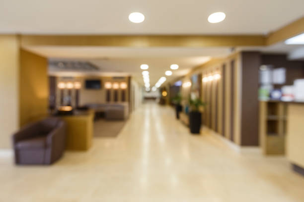 istock Blurred corridor with light lamps in hotel. 1225549411
