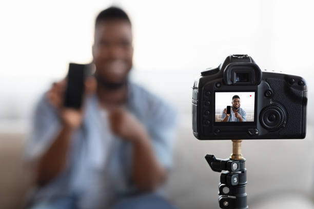 istock Vlogging From Home. Camera Recording Video Content For African American Blogger 1225551462