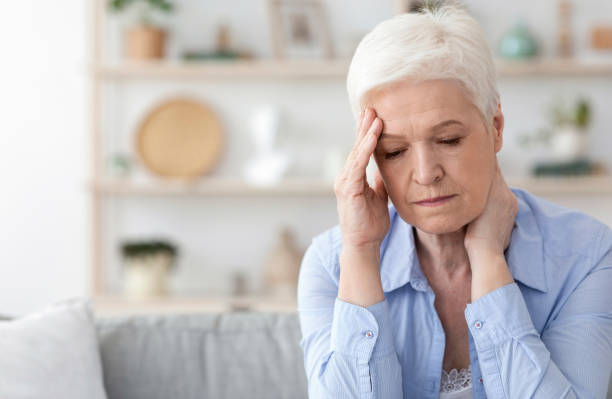 istock Senior Woman Suffering From Headache At Home, Feeling Unwell 1225552191