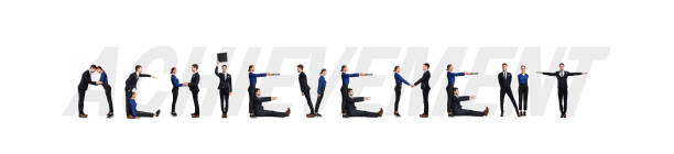 istock Group of people forming achievement word at studio 1225553157