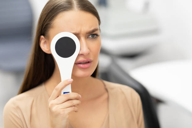istock Patient and optician doing eye test in modern clinic 1225553372