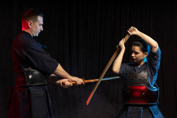 istock young woman learning kendo fighting with teacher 1225554953