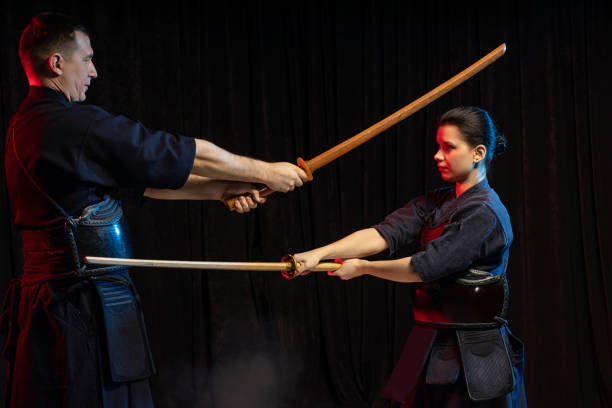 istock two kendo fighters practicing kenjutsu, Japanese martial art using swords 1225555003