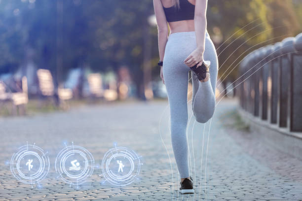 istock Girl does warm-up before jogging with smart watches. 1225555041