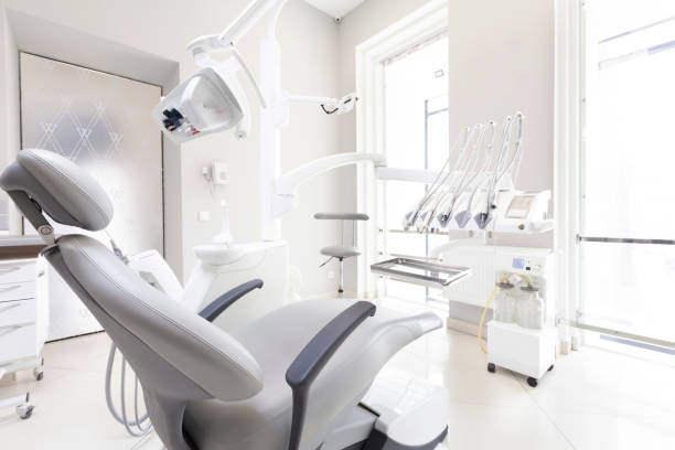 istock Dentist tools and professional dentistry chair in modern clinic 1225556762