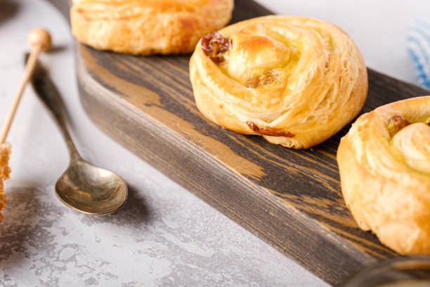 istock Sweet swirl buns with raisins for breakfast 1225558876