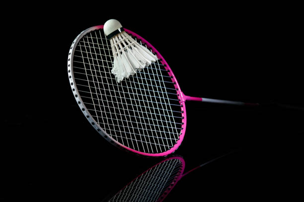 istock Professional sport equipment isolated on black studio background. Badminton racket. 1225560470