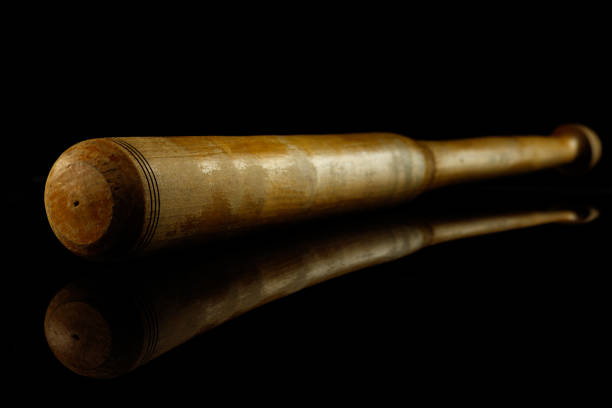 istock Professional sport equipment isolated on black studio background. Baseball bat. 1225560472