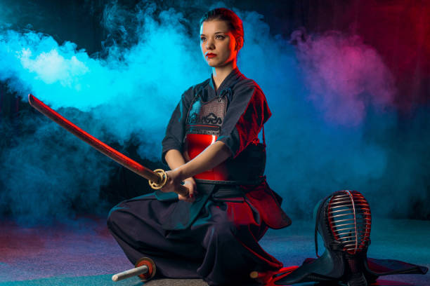 istock confident female kendo fighter isolated 1225560815