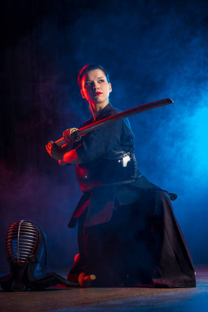 istock powerful female kendo warrior with shinai 1225560888