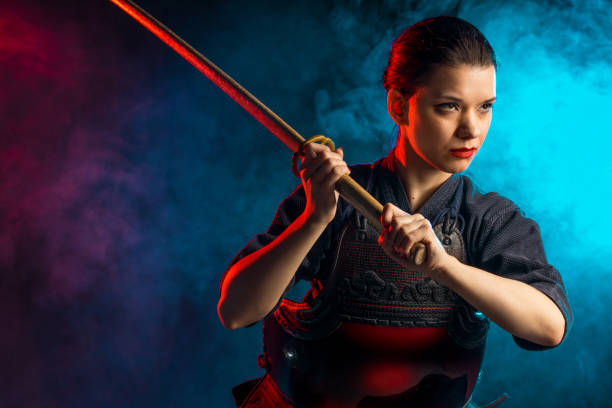 istock confident female kendo warrior with shinai 1225560896