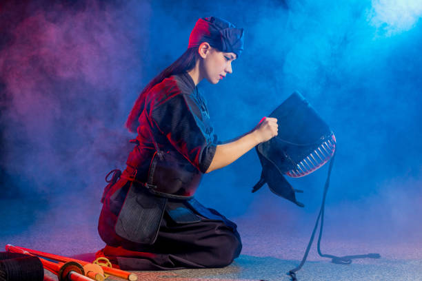 istock kendo female wearing protective helmet on head 1225561162