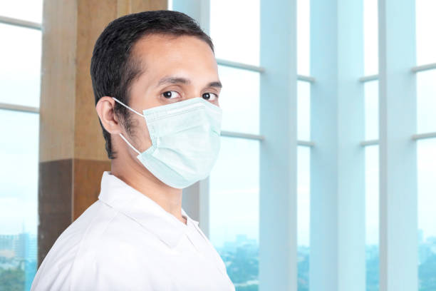 istock Asian man wearing a flu mask 1225562402