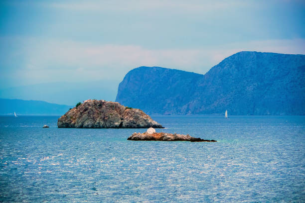 Hydra, Attica / Greece - June 6, 2010: Agios Nikolaos Church on an islet seen from Hydra