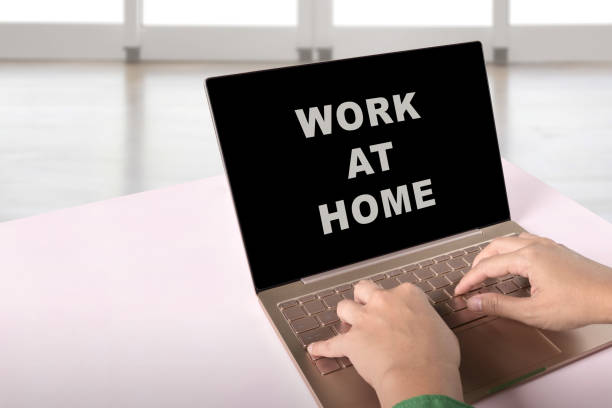 istock Business people using a laptop with a message for Work from home on the screen 1225563193