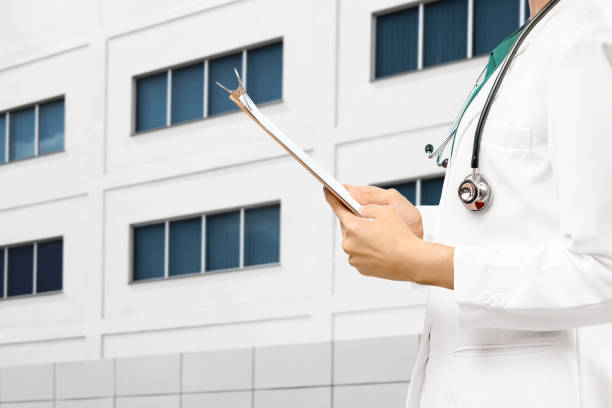 istock Doctor woman with stethoscope holding a clipboard 1225564115