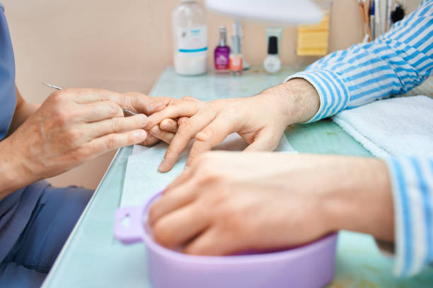 istock man make hygienic manicure in a beauty salon 1225564335