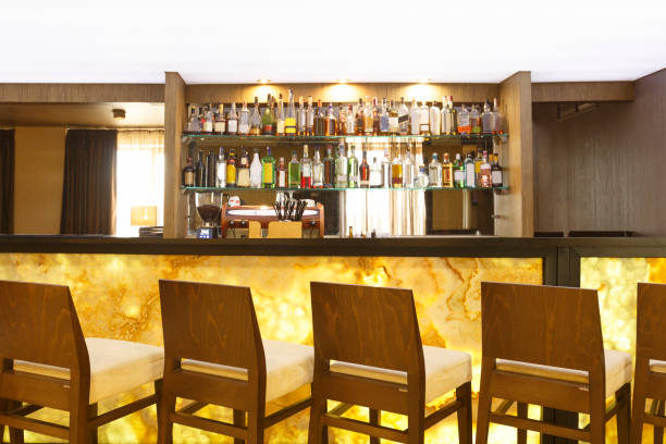 istock Futuristic marble yellow bar counter with chairs 1225568197