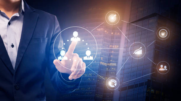 istock Businessman touching icon with human on business process hologram 1225568440