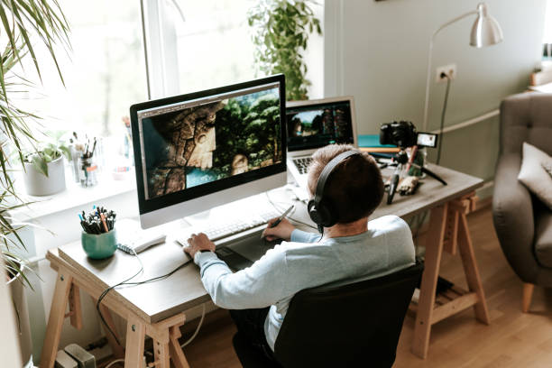 Digital artist drawing on digital surface while video podcasting from home studio