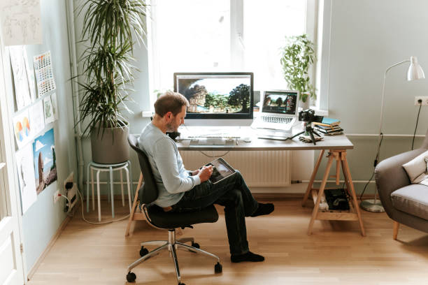istock Mid adult digital artist vlogging from his home studio 1225571215