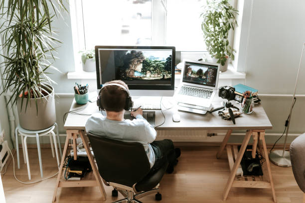 istock Overhead view of digital artist vlogging in his home studio 1225571274
