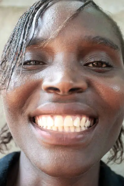 close up of a Zimbabwean woman face , showing off her perfect teeth