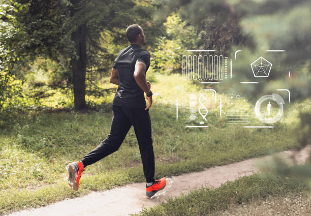istock African american man running in forest with activity indicators on smartwatch 1225572127