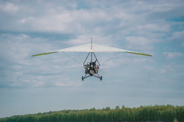 istock The motorized hang glider ready to landing 1225572933