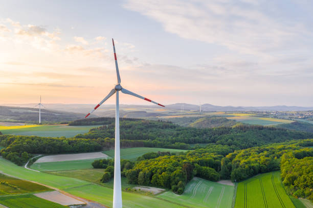 istock wind wheels lush evening sun landscape 1225575197
