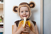 Image of cute toddler wearing a monkey costume