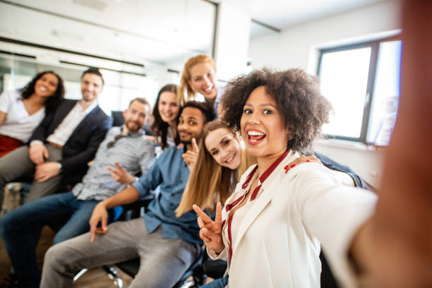 istock Smiling Young Businesspeople Posing for a Group Selfie 1225575977