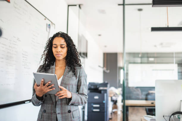 istock Young Mixed Race Businesswoman at Work with Digital Tablet 1225576065