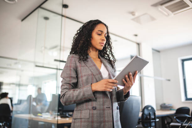 istock Young Mixed Race Businesswoman at Work with Digital Tablet 1225576070
