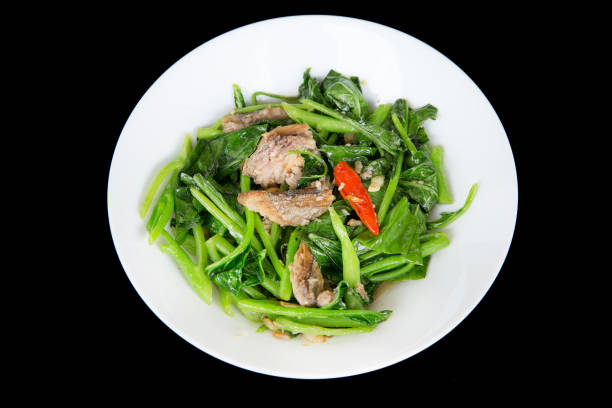 istock Top view or kale with Salted Fish on black isolated. 1225576562