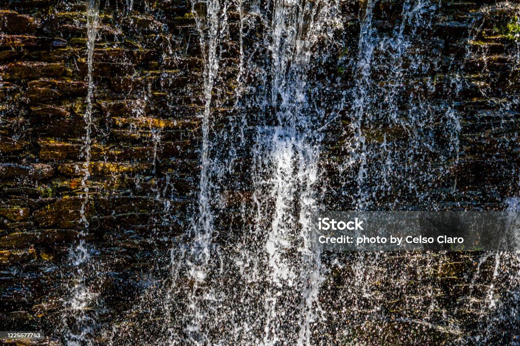 waterfall from a stream shale wall waterfall in the park Abstract Stock Photo