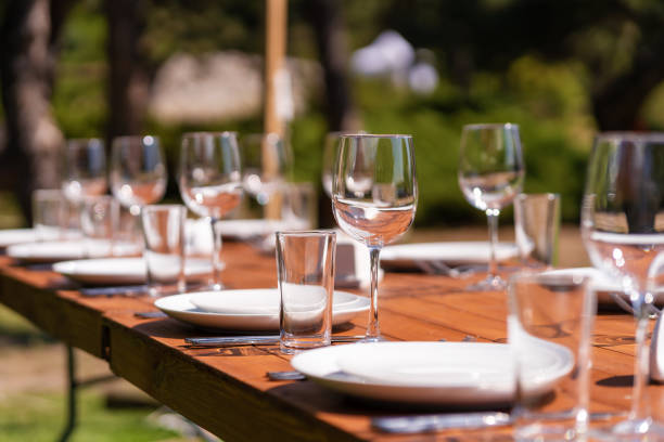 istock Served wooden table without a tablecloth. Cafe in the open air park 1225577850