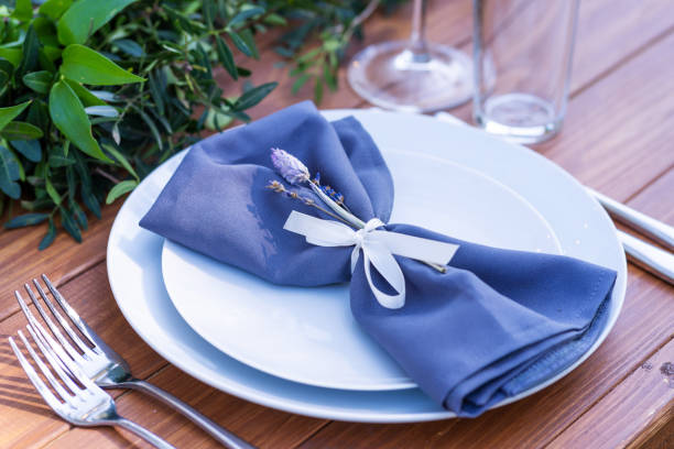 istock Preparing for an open-air party. Decorated with fresh flowers served tables. Table number. Decoration Details 1225577943