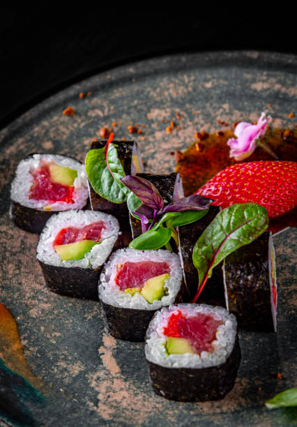 istock sushi roll with tuna, avocado, rice in plate 1225578023