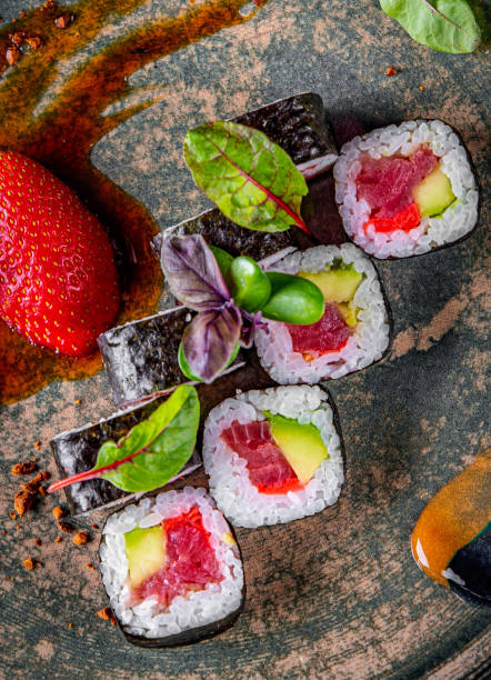istock sushi roll with tuna, avocado, rice in plate 1225578090
